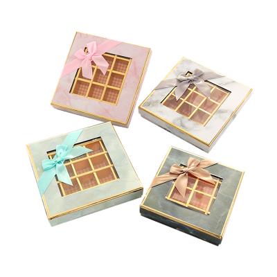 China Factory direct sales printing 9/16/25 gold stamping handmade luxury marble chocolate gift box with red ribbon and window for sale