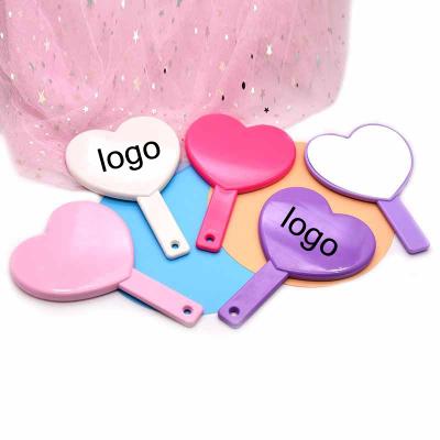 China Hot Sale Hand Held Custom Logo Personalized Heart Shaped Hand Mirror For Makeup Promotional Gifts Magic Mirrors for sale