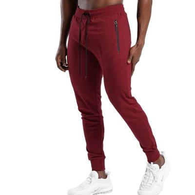 China Custom Slim Fit Pocket Men's Slim Fit Cotton Anti-wrinkle Drawstring Sports Jogger Red Jogger Pants for sale