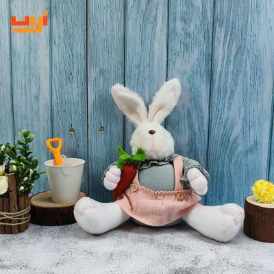 China New Adorable Sitting Rabbit Bunny Doll Handing Carrot Easter Cloth Plush Rabbits for sale