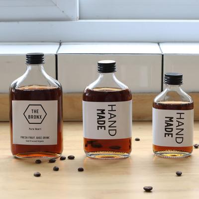 China Hot Sale 250ml 350ml 500ml Small Mouth Creative Flat Coffee Juice Vodka Bottle Cold Brew Beverage Glass Bottle for sale