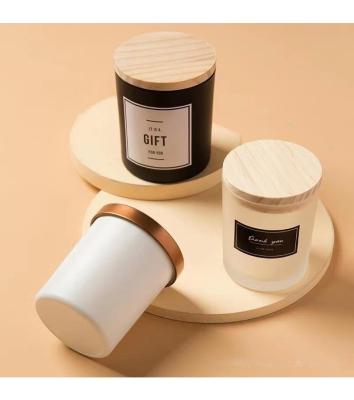 China Home Decor Custom Logo White and Black Matte Frosted Colored Spray Glass Candle Jars with Wooden Metal Bamboo Lids for sale