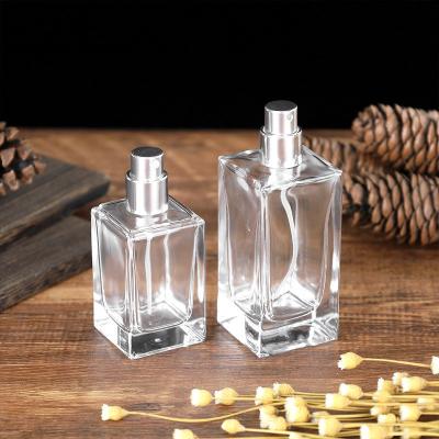 China 30ml 50ml 100ml cosmetic wholesale luxury square perfume empty packaging glass bottle with wooden lid and cover for sale