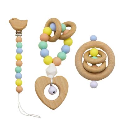 China 100% High Quality Eco-Friendly BPA Free 3 Pcs Love Wooden Dummy Teether Ring Rattle Silicone Pacifier Chain Baby Clip Teether Gift Set For Newborn for sale