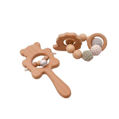 China Hot Sale Eco-Friendly Designer Natural Baby Rattle Wooden Crochet Ball Bracelet Baby Wooden Toy Rattle Bracelet Wooden Teether Set for sale