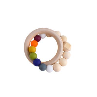 China Wooden Toy New DIY Wooden Teeth Silicone Teeth Soft Creative Wooden Baby Bead Ring Soothing Baby Rattle Teether for sale