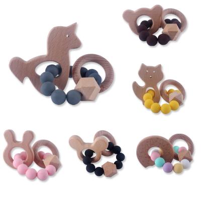 China 100%food grade silicone Teether style food grade silicone the new bead Wooden Ring Teether Rattle Toy Baby Teething Cartoons Beech for sale