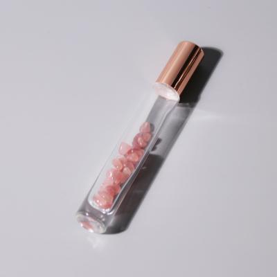 China 10ml Glitter Gemstones Eco-friendly Roller Bottle Rose Gold Crystal Essential Oil Roller Bottle for sale