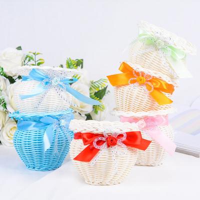 China Viable rattan weaving flower basket creative vase containing flower basket home and office decoration crafts for sale