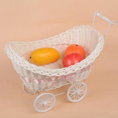 China Lovely Small Flower Rattan Bicycle Gift Basket Plastic Table Top Car Gift Four-Wheeled Basket Viable Iron Decorative Art for sale