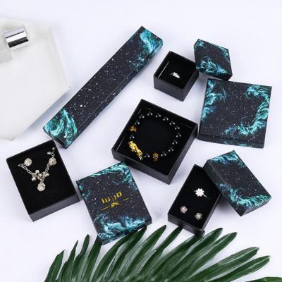 China Handmade Custom Green Blue Starry Sky Logo Light Cardboard Star Packaging Jewelry Box for sale