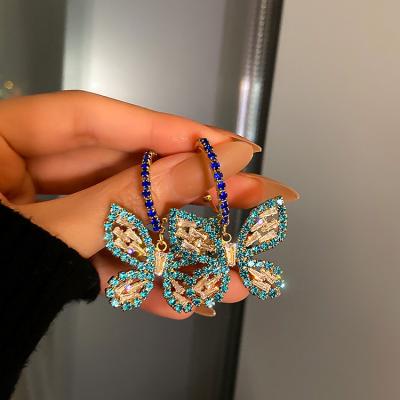 China Fashionable Full Crystal 925 Rhinestone Pendant Circle Pendant Sterling Silver Needle Earrings Zircon Blue Butterfly Earrings for sale