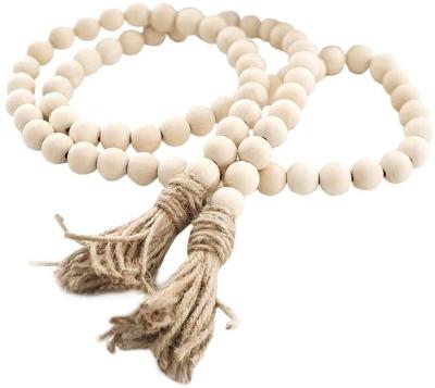 China 100% Amazon Handmade Wholesale Custom Best Selling Cheap Farmhouse Beads 58in Wooden Bead Garland With Tassels for sale