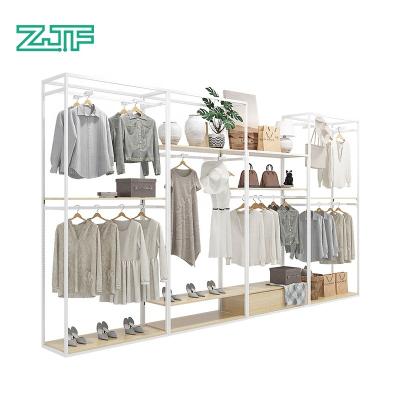 China Eco-friendly Kids Clothes Store Equipment Custom Material Wooden Metal Clothing Retail Display Racks for sale