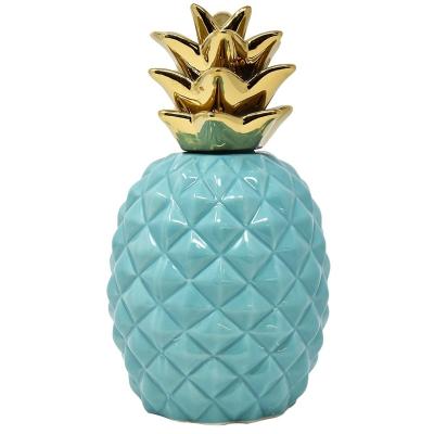 China Handmade Ceramic Coral Pineapple Showpiece Beautifully Sculpted With Realistic Detail, Coral Gloss With Gold Metallic Crown for sale