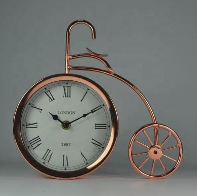 China Antique Style Metal Crafts Cycle Table Clock for sale