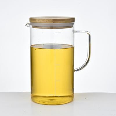 China Sustainable Heat Resistant Bamboo Tea Kettle Lid Water Jug Borosilicate Glass Water Pitcher for sale