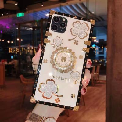 China Luxury square four leaf shockproof clover pink tpu phone case for iPhone 12 phone case with bracket for sale