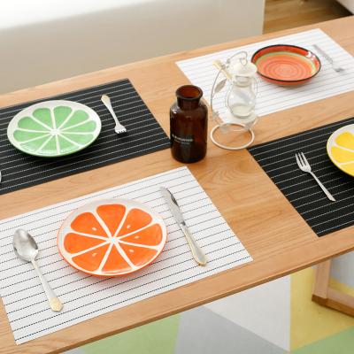 China Creative Simple Stocked Nordic Style Kitchen Dining Plastic Desk Mat Dining Table Placemat PVC for sale