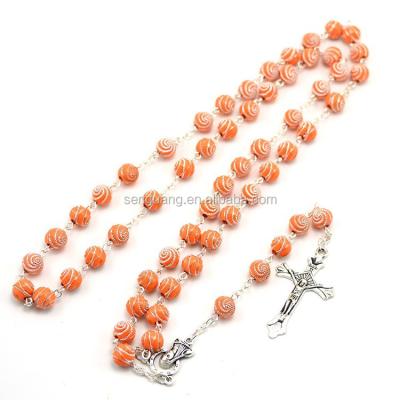 China Orange Cross Pendant of Jesus Christian Rosary Necklace With Religious Helix Carved Rosary Bead Crucifix for sale