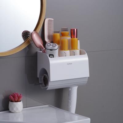 China Bathroom Viable Nailless Blow Rack Holder Dryer Hair Care Styling Tool Wall Organizer Adhesive Hair Dryer Rack for sale