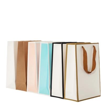 China Recyclable hot sale coutom new design logo cheap branded gift white paper bag packaging bag for sale