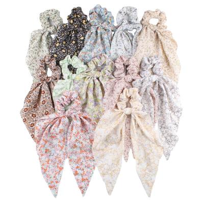 China Fashionable scrunchies 12 colors popular tail scrunchies women's hair accessories flower scrunchies in Europe and America for sale