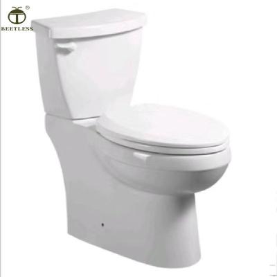 China Double-Flow Two Pieces Of Oval Shape Ceramic Material And Round Wash Down Ceramic Toilet for sale