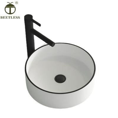 China Modern Round Shape Black Edge Color Thin Edge Ceramic Bathroom Table Basin For Hotel for sale