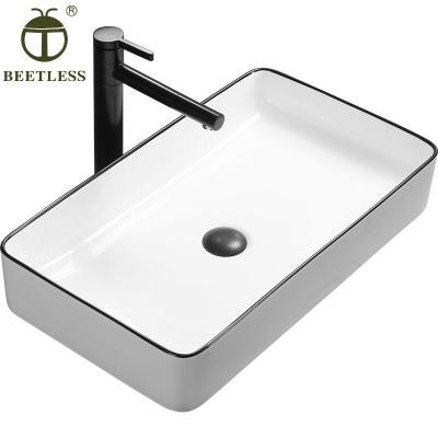 China Modern Black Straight Edge White Colored Rectangular Bathroom Ceramic Wash Basin for sale