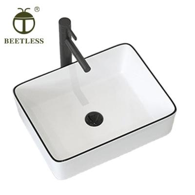 China Black Line Rectangle Porcelain Countertop Luxury Bathroom Good Straightness Modern Sink for sale