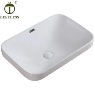 China Hot Sale Modern Rectangular Semi-Recessed Semi-Counter Wash Basin Curved Ceramic Sink for sale