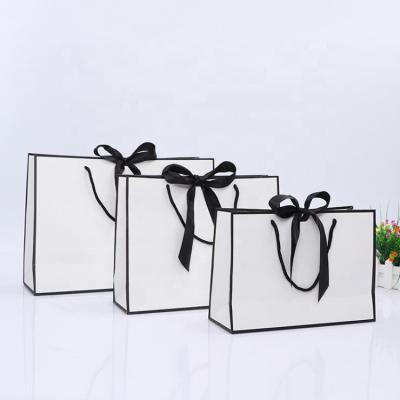 China Disposable China Manufactures White Luxury Small Carrier Wedding Printed Gift Paper Bag With Custom Handle Logo for sale