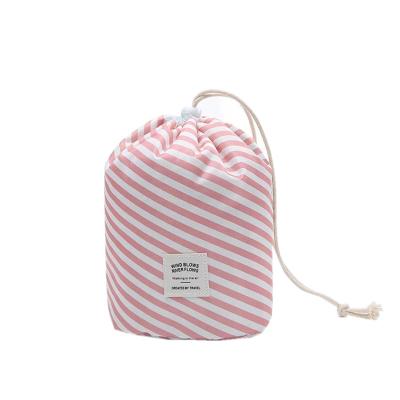 China Durable Hot Popular Barrel Shaped Makeup Bag Storage Pouch Organizer Beauty Kit Drawstring Around Cosmetic Bag for sale