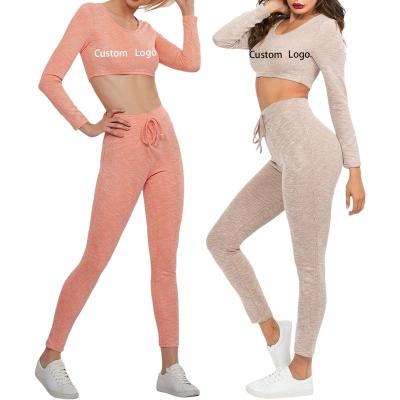 China Oti QUICK DRY Textile American And European Style OEM Two Piece Set Knitted Suit Fits Long Sleeve Crop Top Skinny Pant Tracksuits Women for sale