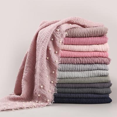 China Newest Desgin Women's Classic Cotton Scarf 180*95cm Hijab Muslim Solid Color Pleat Pearl Hijab Scarf Women for sale