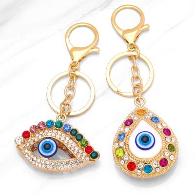 China Small Water Colored Diamond Devil's Eye Metal Key Chain Pendant Gift Bag Creative Pendant Souvenir Gifts Promotion Manufacturer for sale