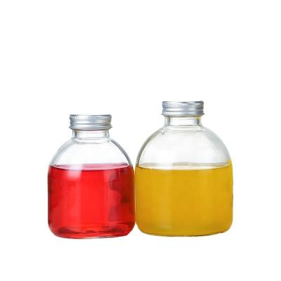 China Wholesale 300ml500ml Juice Milk Bottle Beverage Glass Beverage Bottle With Lid for sale