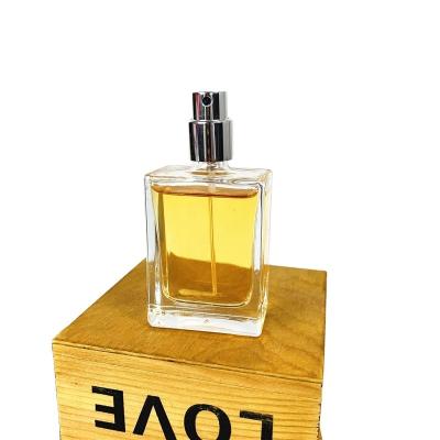 China Perfume newly designed mini30ml transparent square glass perfume spray bottle with crimp cap for sale