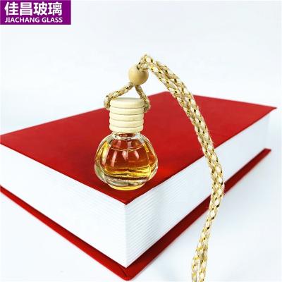 China PERFUME Car Perfume Glass Bottle 10ml Empty Hanging Perfume Bottle Essential Oil Diffuser With Wooden Cover for sale