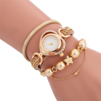 China Luxury 4155 Day/Date Heart Dial Women Watches Ladies Gold Jewelry Chain Round Wrap Bracelet Watch for sale