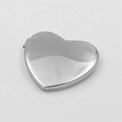 China Stainless Steel Makeup Mirror Heart Shape Makeup Magnifying Vanity Mirror For Office Travel Small Folding Mirror for sale