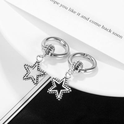 China 2021 FASHION Trend Trendy Star Stainless Steel Hollowed Five-pointed Ear Studs Simplicity Cold Style Open Earrings For Women Men for sale