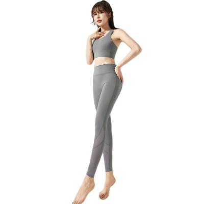 China Mesh Stitching Fitness Yoga Clothing breathable fits women's beautiful back upper bra and spats two-piece suits for sale