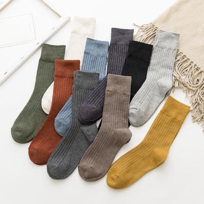 China 2021 New Cotton Wholesale Pure Color Tube Jacquard Stripe Japanese Style Breathable Medium Female Socks for sale