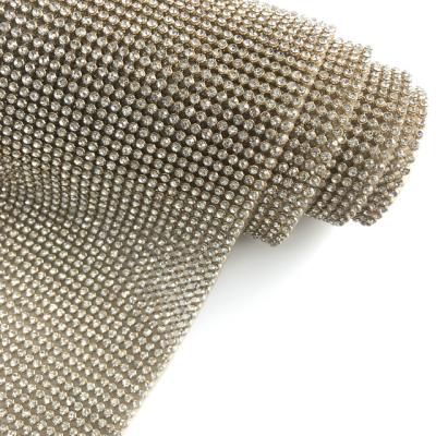 China Durable Bling Bling Heat Transfer Crystal Mesh Trimming Roll Hotfix Rhinestone Metallic Base Sheet For Clothes for sale