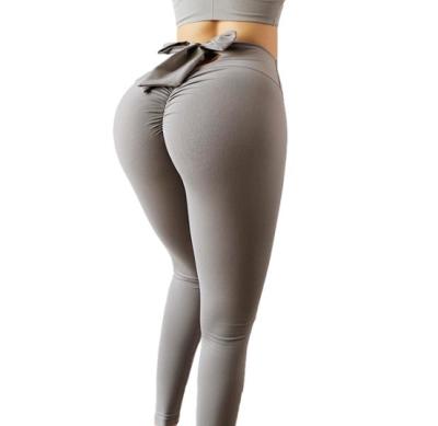 China Breathable High Waist Hip High Waist Yoga Pants Seamless Tight Exercise Bow Lift Pants Elastic Back Women Fitness for sale