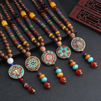 China FASHIONABLE Wholesale Handmade Nepal Religion Jewelry Vintage Tribal Wood Beads Long Tassel Pendant Necklace for sale