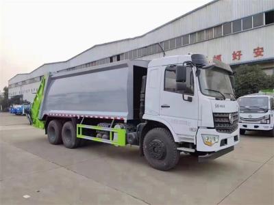 China Camión de basura Lavar Dongfeng 5995 Kg Compactor Camión de basura Con chasis de acero al carbono en venta