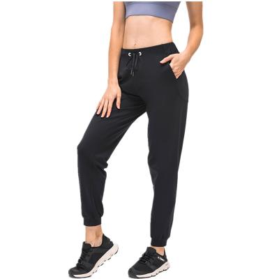 China Wholesale Gym Women's Xsunwing Breathable Athleisure Pants With Pocket Elastic Fitness Wear Ladies Tiktok Gaiters Yoga Tights Women for sale